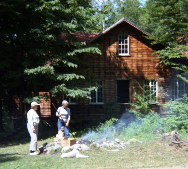Reg & Fran in front of the Big House, ca. 1962, with their Bedlington terriers.